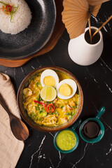 Delicious Indonesian Soto Ayam with Boiled Eggs and Rice.