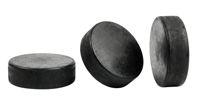 Black ice hockey pucks isolated on white background