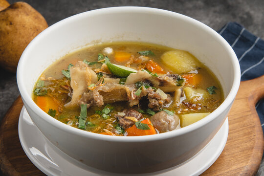 Delicious Oxtail Soup with Vegetables in a White Bowl.