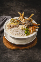 Delicious Seafood Noodle Soup with Crab and Vegetables.