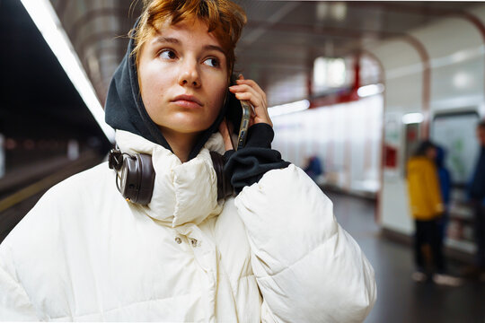 young woman in underground city transport - Powered by Adobe