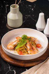 Delicious Shrimp Scampi Pasta Dish on a Wooden Board.