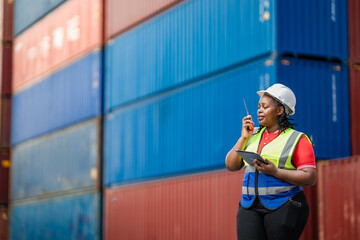 Professional shipping supervisor conducting real-time communication and digital inspection in a container terminal environment.