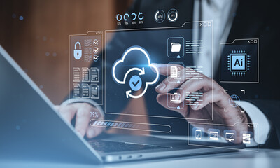 Cloud data synchronization and cybersecurity concept with holographic interface on business technology background in modern digital workspace..