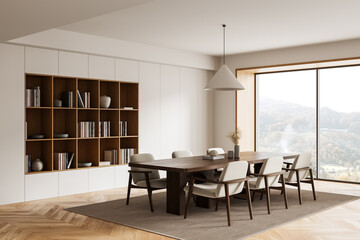 Modern dining room interior with wooden furniture, built-in bookshelf, large window and minimalist decor in natural tones and soft daylight setting. 3D Rendering