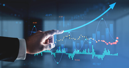 Businessman pointing at rising forex and stock market chart with data analytics and upward arrow on digital interface background in financial concept.