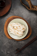 Delicious Tempeh Dish on a Wooden Plate.