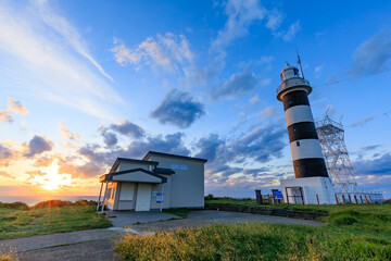 夕日と秋の入道埼灯台　秋田県男鹿市　Sunset and Nyudozaki Lighthouse in autumn. Akita Pref, Oga City.