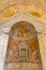 Ancient frescoes depicting saints in Tempietto sul Clitunno