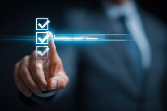Businessman's finger touching a digital checklist with progress bar on futuristic screen. A hand interacting with a glowing interface, completing tasks on a virtual checklist with a loading bar. - Powered by Adobe