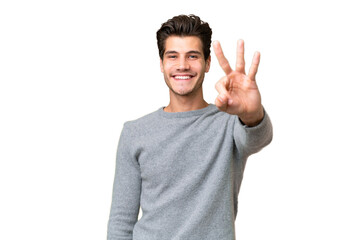 Young handsome caucasian man over isolated background happy and counting three with fingers