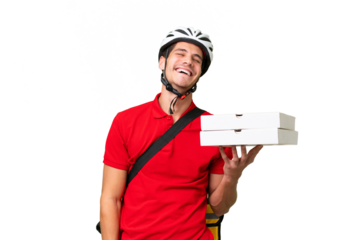 Pizza delivery man with work uniform picking up pizza boxes over isolated background laughing