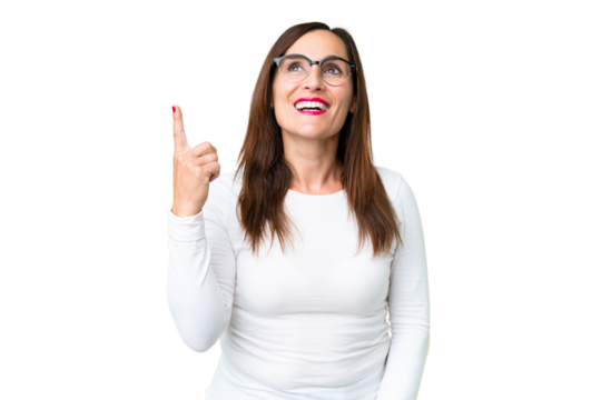 Middle age woman over isolated chroma key background pointing up and surprised - Powered by Adobe