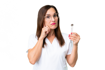 Dentist caucasian woman over isolated chroma key background thinking an idea