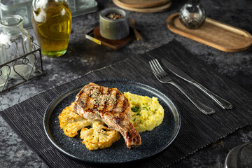 Grilled pork chop with mashed potatoes and cauliflower dinner