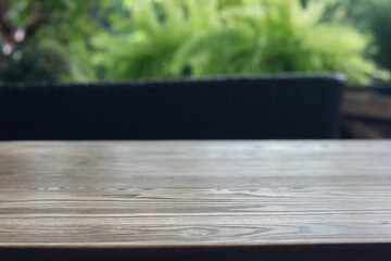 Wooden table surface with natural cafe background