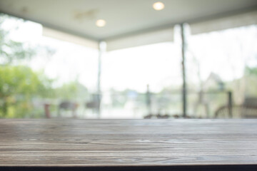 Wooden table surface with natural cafe background