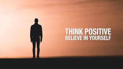 Obraz premium . Silhouette of man with think positive believe in yourself message at sunset 