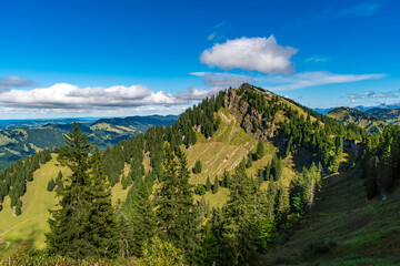 Obraz premium Majestic Allgaeu Alps peak bathed in golden autumn sunlight during serene hike