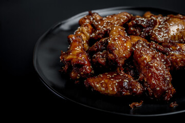 Smoked chicken wings glazed in sticky soy sauce 
