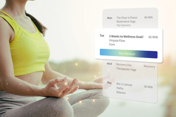 Asian young adult woman practicing yoga meditation wellness app daily workout schedule fitness goal healthy lifestyle mindful living