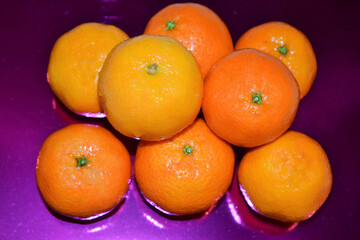 Festive table. Tangerines are laid out on the table.