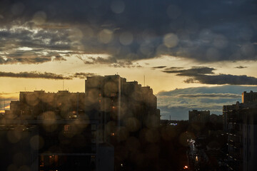 Cityscape Silhouettes Against Cloudy Sunset Sky