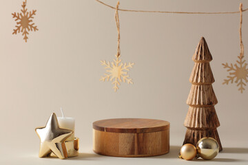 Empty wooden stand for products with carved Christmas tree and golden star.