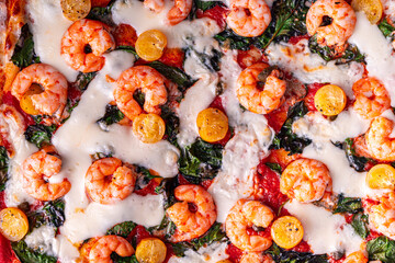 Pizza with shrimp and spinach with cheese. close-up, background, top view. High quality photo