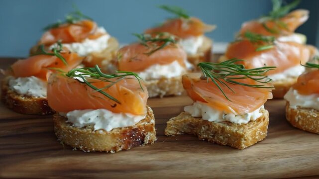 A beautifully arranged platter of smoked salmon canap?s on toasted bread, garnished with fresh herbs, set against a soft blue backdrop, perfect for a gourmet catering event