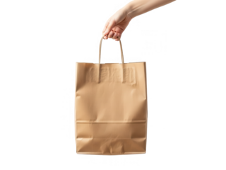 A hand offering a brown paper bag against a dark isolated background