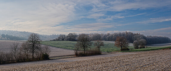 Winter. Landscape photo taken in frosty temperatures in Kraichgau, Germany. Fields and forests covered in hoarfrost.