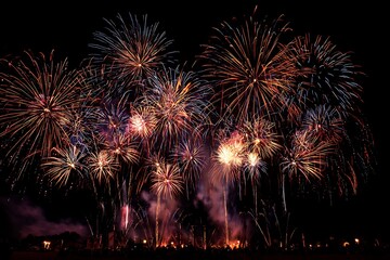 An enchanting firework finale with hundreds of glowing bursts filling the entire sky in a cascade of colors