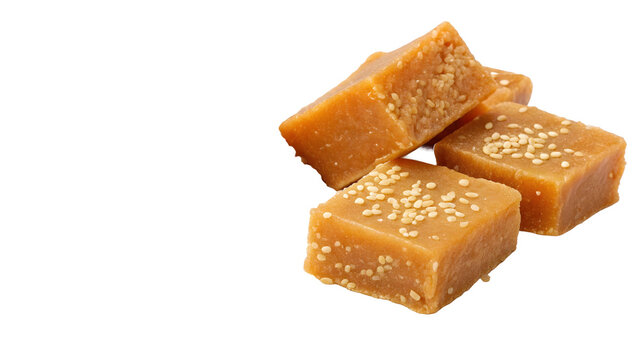 Til Gul Jaggery PNG
Stack of light brown/caramel jaggery (gud) pieces sprinkled with sesame seeds (til) on transparent background.
