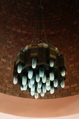 Original chandelier under brick dome.