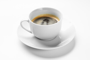 A single white ceramic espresso cup and saucer containing hot black coffee with crema, isolated on a clean white background with subtle shadow