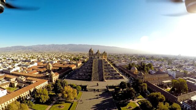 Aerial View of Quetzalcoatl Pyramid in Cholula Puebla Mexico Revealing Ancient City Structures Under Clear Blue Sky