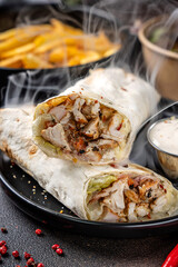 Hot chicken wrap with melted cheese and sauce