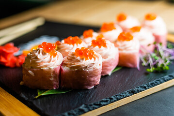 Close-Up of Elegant Salmon Sushi Rolls with Roe