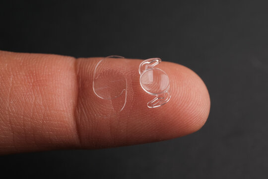 Microscopic View of a Clear, Biocompatible Acrylic Phaco-Foldable Intraocular Lens (IOL) Ready for Implantation in the Human Eye to Restore Vis