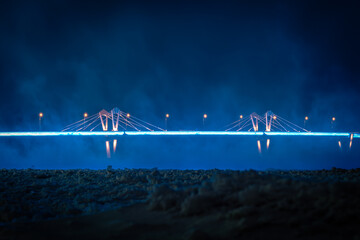 Night view of an illuminated bridge crossing the Zeya River in Blagoveshchensk, Russia