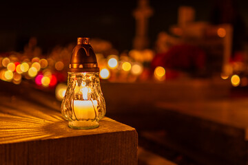 Cemetery Candle Lantern Glowing At Night, Remembrance Light With Bokeh For Prayer