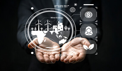 Hands Holding Digital Interface Representing Wind Energy Concept with Modern Icons, Graphs and World Map for Sustainable Development and Environmental Awareness