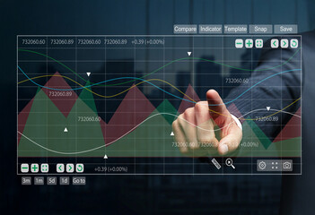 Business person interacting with financial data dashboard, analyzing market trends and stock performance with transparent touch interface in modern office