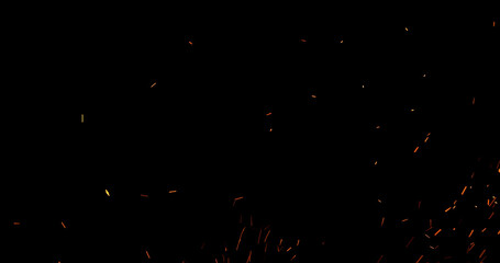 Realistic fire sparks flying through the air, isolated on a black background. Perfect as a cinematic VFX overlay, fire particles effect or visual element.