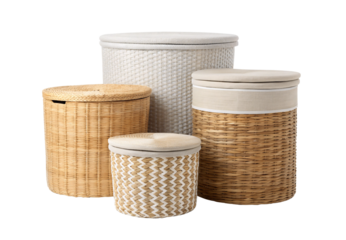 Four wicker laundry hampers with fabric liners in assorted sizes, isolated on a transparent background