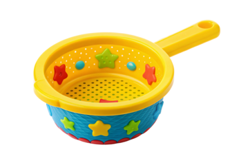Yellow plastic sand sifter with star decorations and handle toy, isolated on a transparent background