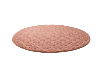 Round pink textured bath mat with diamond quilted pattern, isolated on a transparent background