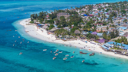 aerial landscape view of most northwestern part of island of Zanzibar with Nungwi beach - with white sand and turquoise water - a popular tourist destination, located in west part of Nungwi village