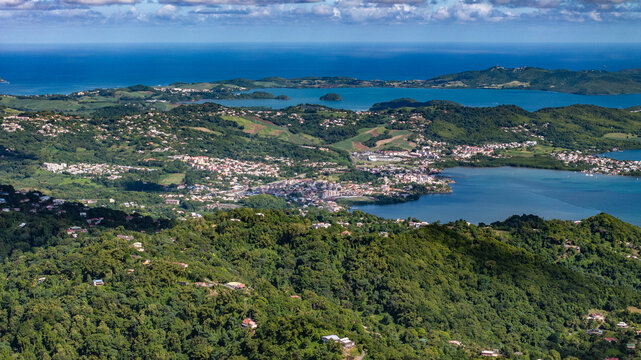 aerial landscape view of Le Robert a town situated on the Bay of Robert (Baie du Robert), a large bay on the Atlantic east coast of Martinique, surrounded by green, hilly landscape, Caribbean Sea